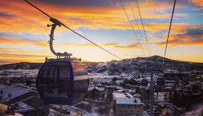 sunset over steamboat springs with gondola in the silhouette.